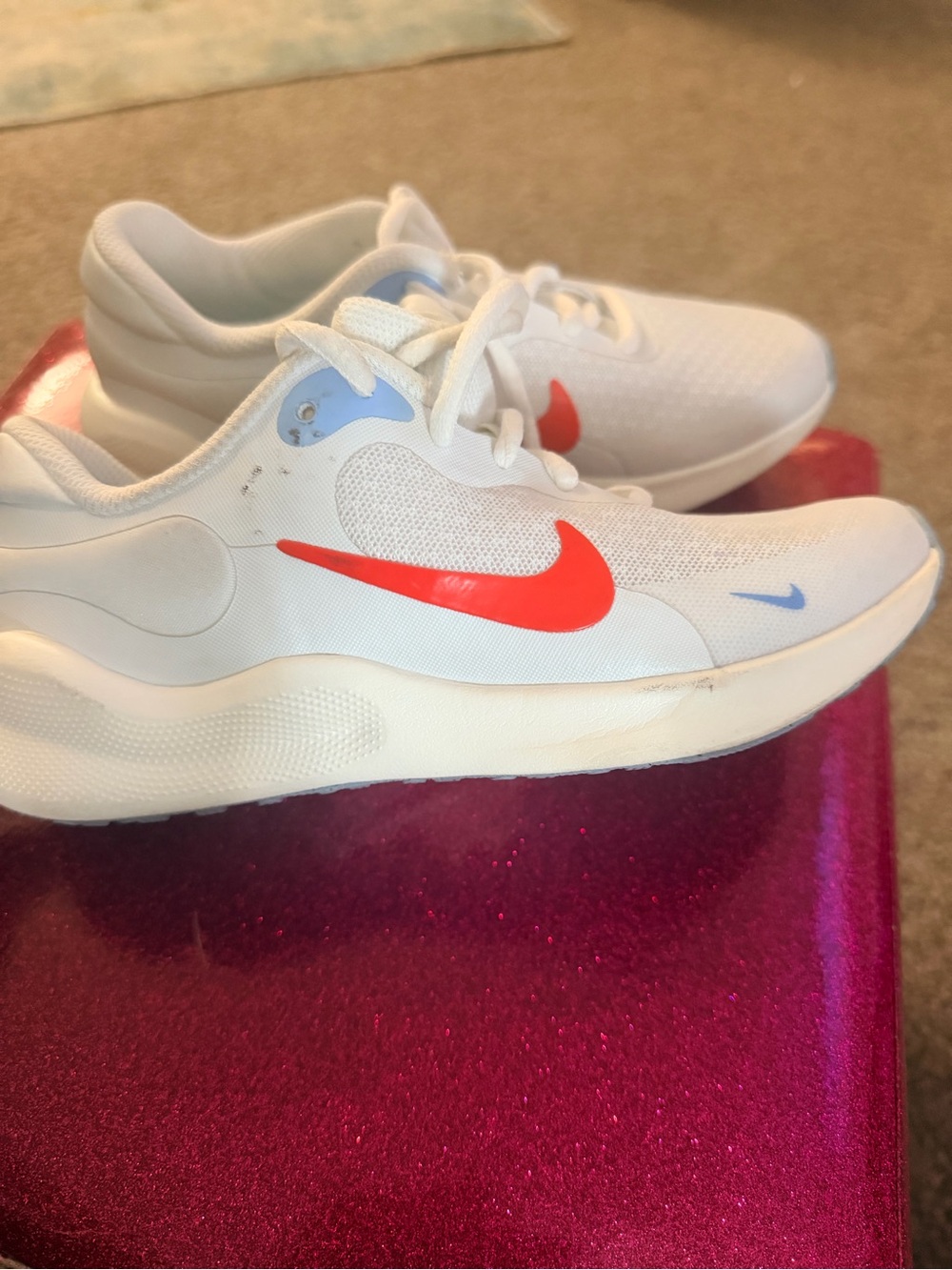 Nike Kids White Sneakers with Bright Red Swoosh and Light Blue Accents